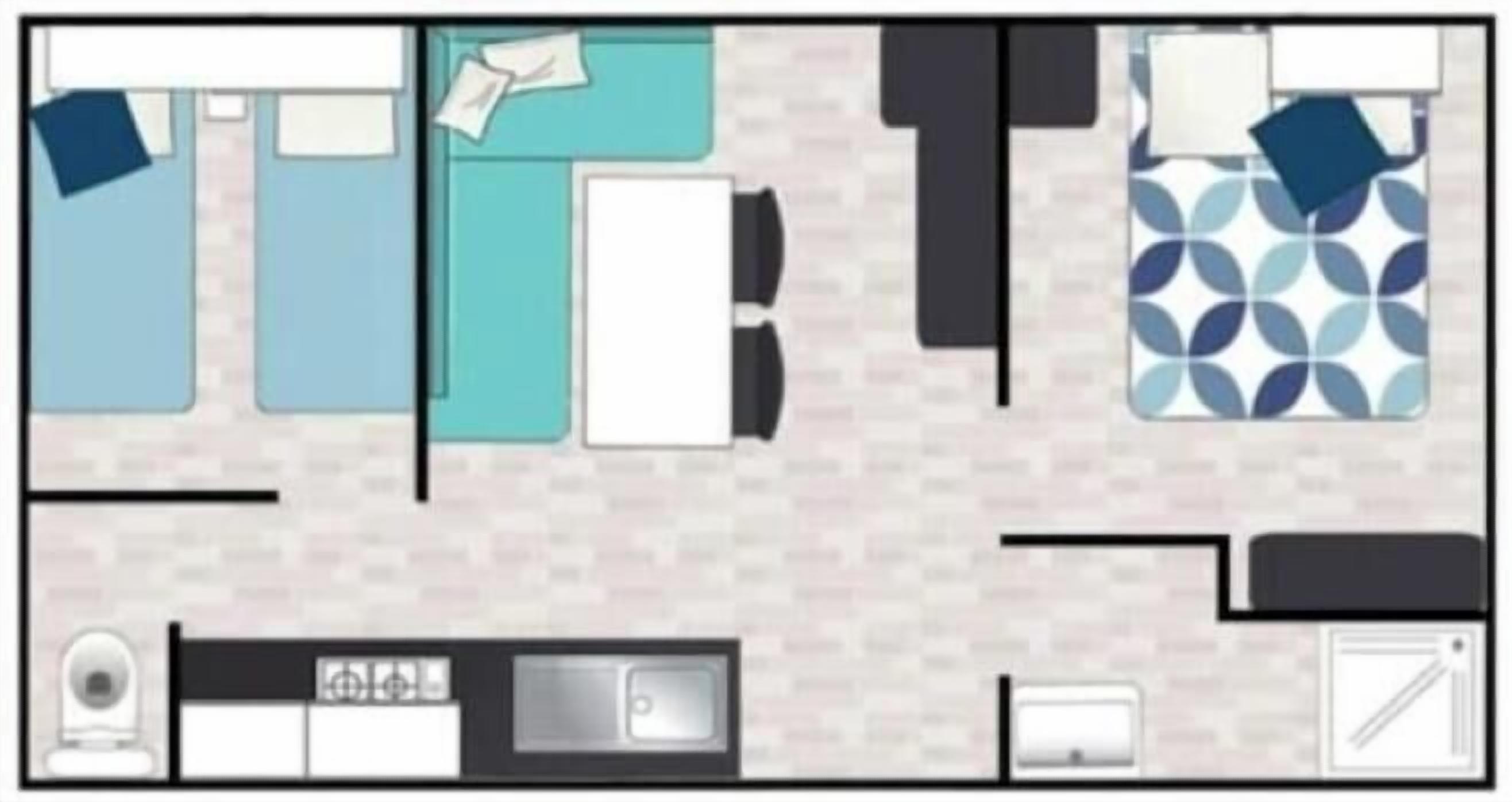 Distribución de una habitación de hotel con cama, escritorio, silla, armario, baño y kitchenette.