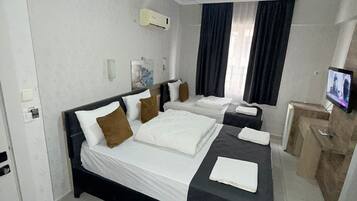 Familiekamer | Italiaanse Frette-lakens, luxe beddengoed, donsdekens, pillowtop-bedden