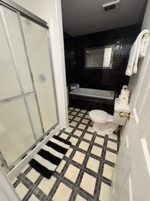 Jetted bath, hair dryer, towels, soap