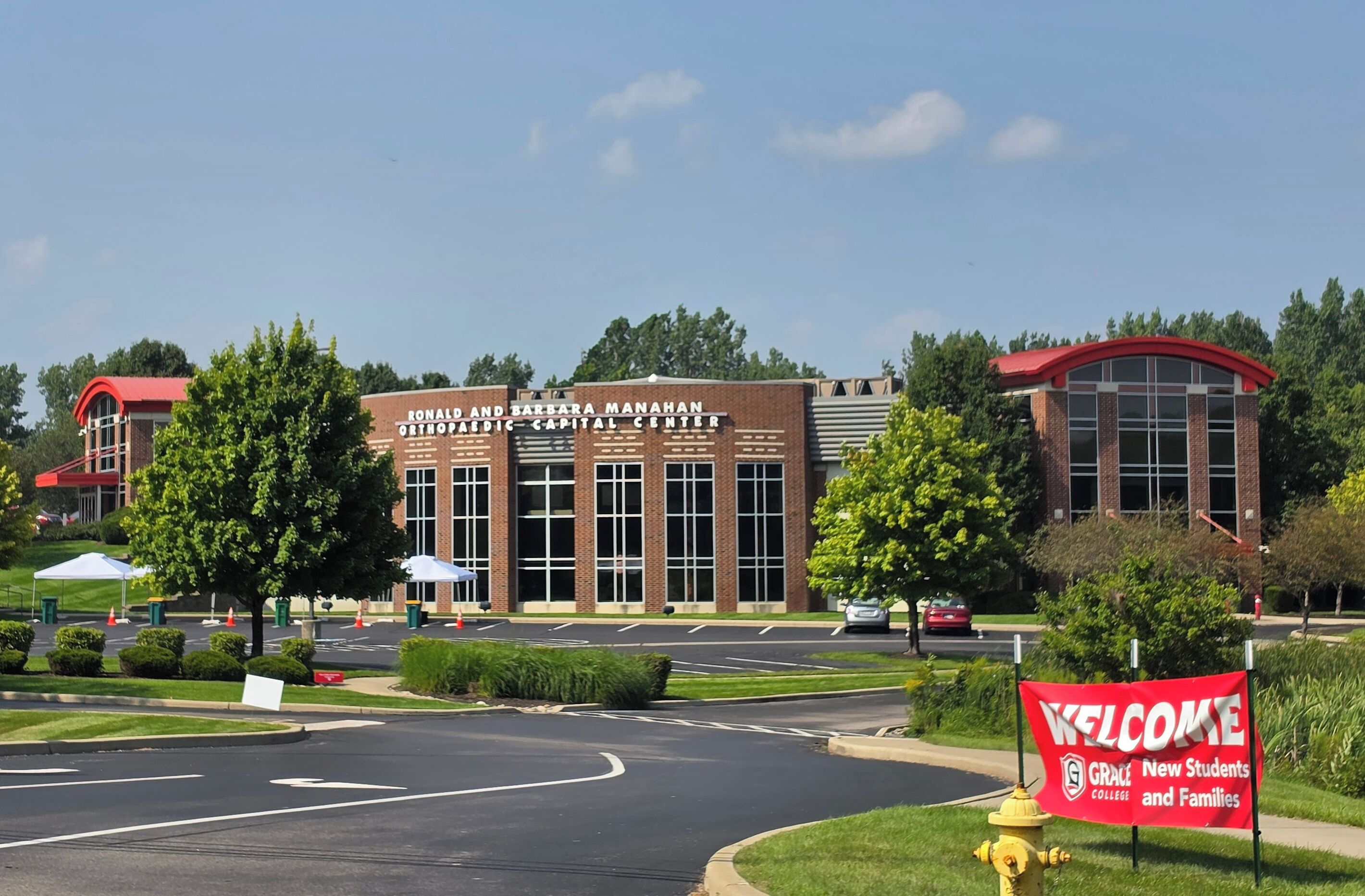 A building with a sign reading 'Ronald and Barbara Manahan Orthopedic Capital Center.'