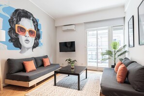 Apartamento conforto, vista para a cidade | Área de estar