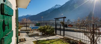 Casa Olinda, which opens to Mount Emilius and the Gran Paradiso massif.