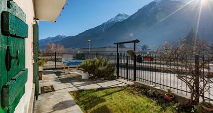 Casa Olinda, which opens to Mount Emilius and the Gran Paradiso massif.