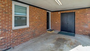 A brick building with a single door and a window. - Near Medical Centers & Fort Jackson! Quiet Home (Columbia)