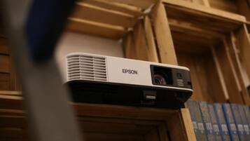 An Epson projector mounted on a wooden structure.