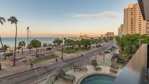 A coastal urban area with a pool, promenade, and high-rise buildings. - Iracema Residence #103 - Seafront by Carpediem (Fortaleza)