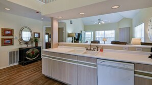 A modern kitchen with a dishwasher, double sink, and a large mirror. - Perfect 3 Bedroom-3 Bath Condo / Gorgeous Views / Heart of Branson/ Affordable (Branson)