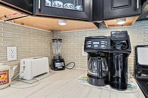 A kitchen with a coffee maker, a blender, and a toaster. - Cozy Glen Cove Apt Near Ferry, Parking & NYC! (Glen Cove)