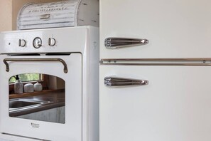A white kitchen with a built-in oven and two chrome handles on the door. - House with a View, Mucharz 405 (Mucharz)