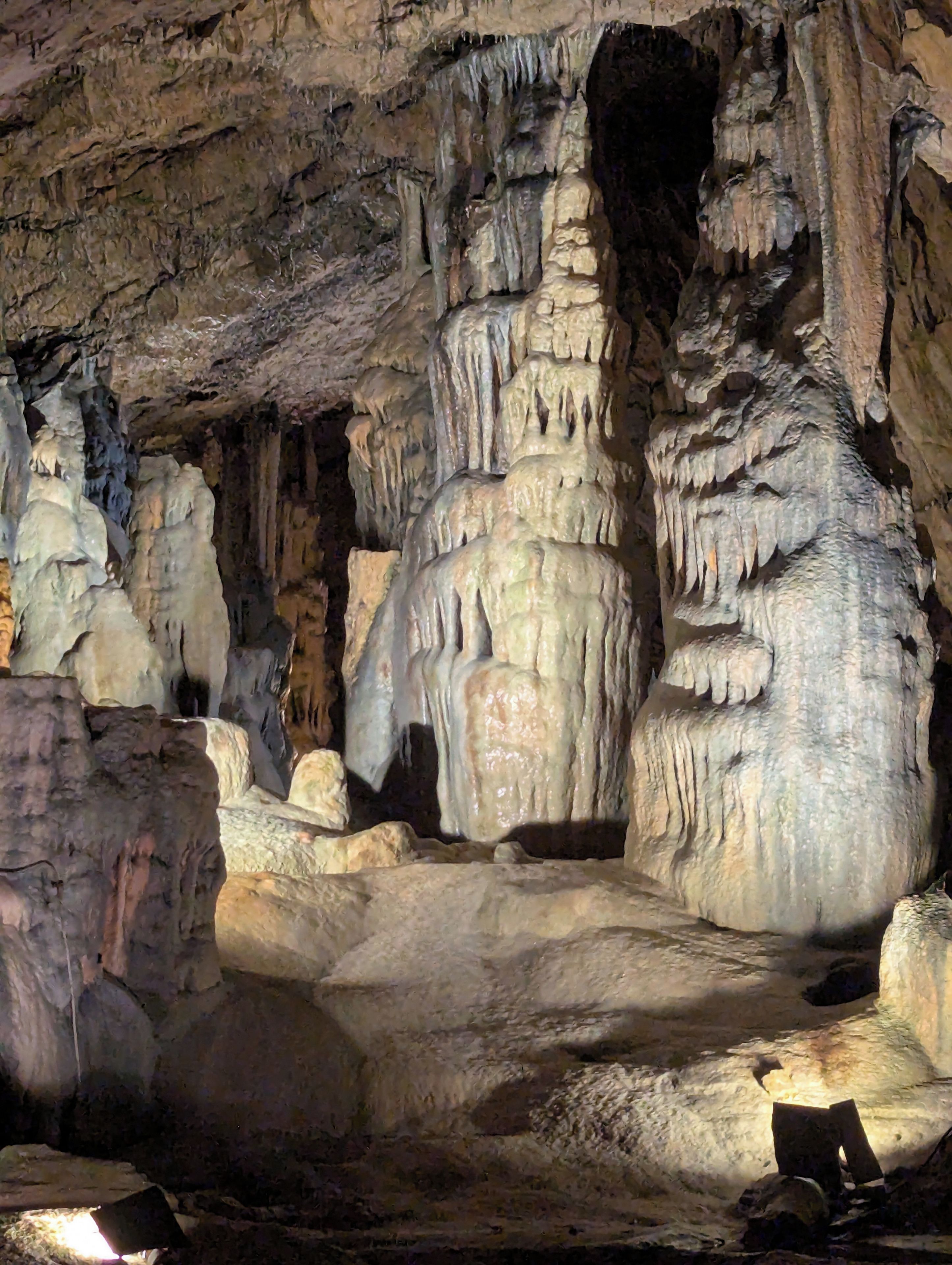 A cave interior with stalactites and stalagmites.