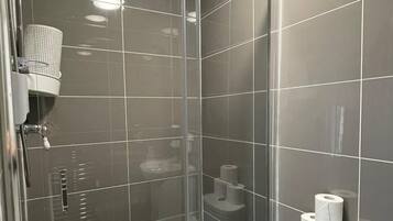 Shower, hair dryer, towels, toilet paper