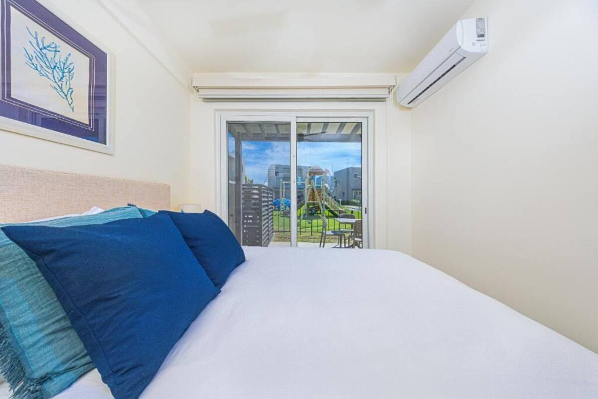 Deluxe Villa, Partial Ocean View | Down duvets, pillow-top beds, individually decorated