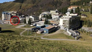 A hotel complex with multiple buildings, including a large multi-story structure and several smaller ones. - Gourette - Apartment 8 pers, South Balcony, Linens included, Pets allowed (Gourette)