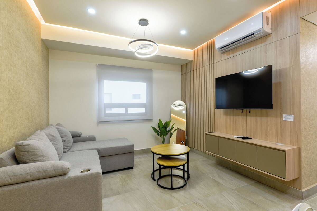 Standard Suite, City View | Living area | 55-inch Smart TV with digital channels, streaming services