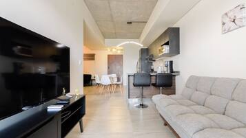 Classic Suite, Balcony, City View | Living area | Streaming services