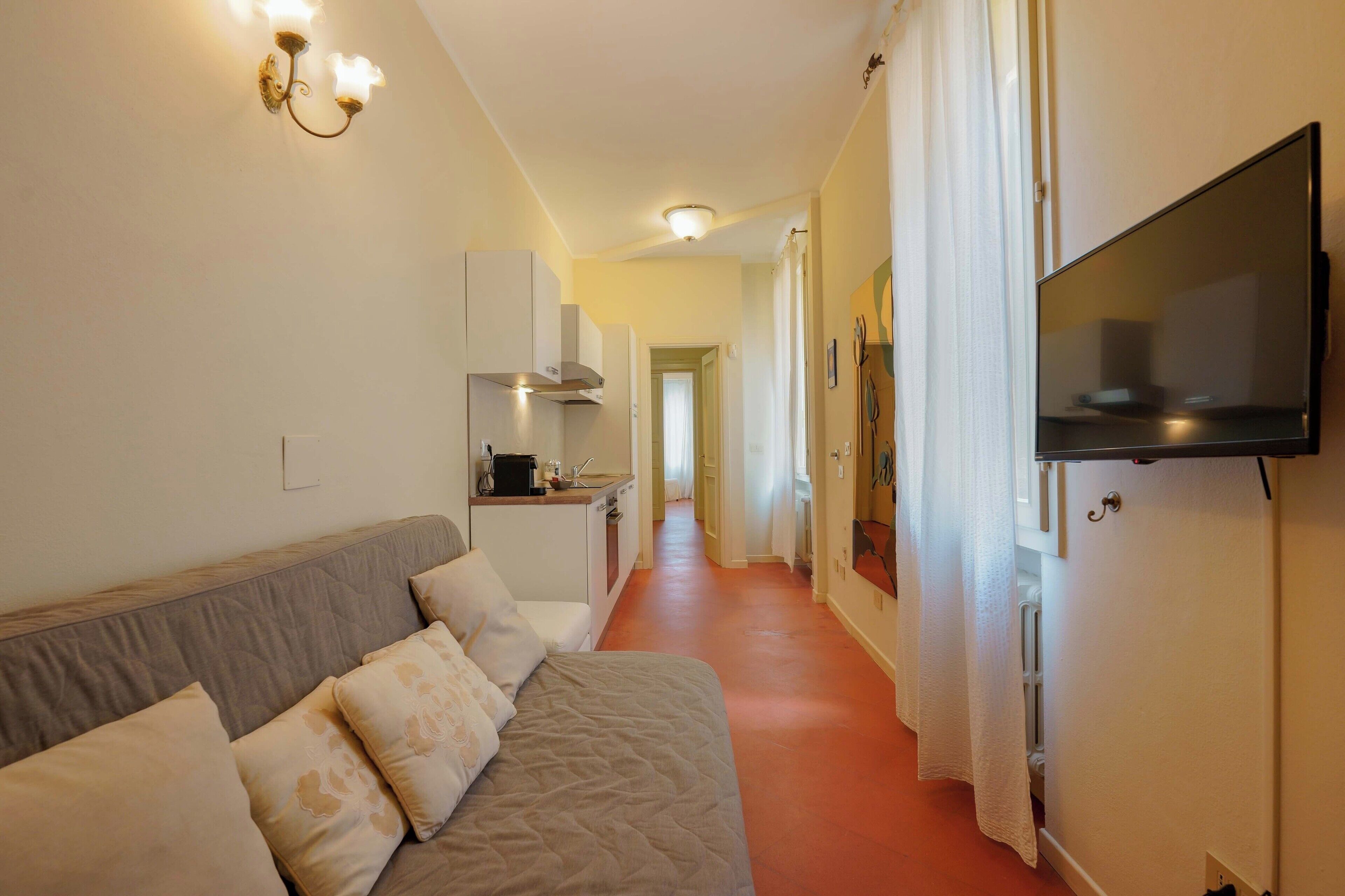 Apartment (Family Retreat - Primo Piano) | Wohnbereich | 40-Zoll-Flachbildfernseher mit Digitalempfang