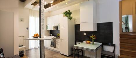 Apartment (Family - Via de Castagnoli 4) | Private kitchen | Full-size fridge, oven, stovetop, espresso maker