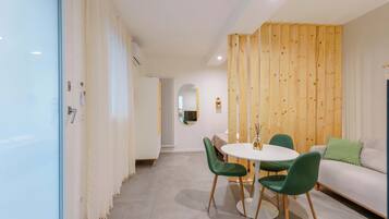 Apartment (Levante Boho Studio) | Living area | 45-inch flat-screen TV with digital channels