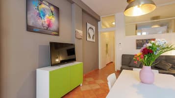 Apartment (Zamboni 58) | Living area | 45-inch flat-screen TV with digital channels