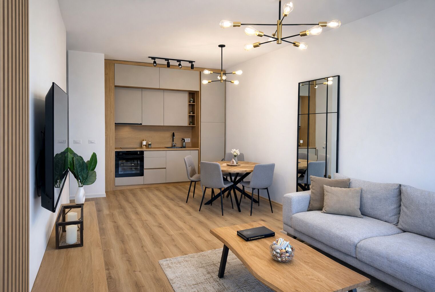 Un salon moderne avec un canapé, une table basse et un coin repas.