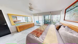 A modern bedroom with a bed, a dresser, a large window, and a painting on the wall. - Océano Aria, Entire Lodging: Condominium in Bucerias, Mexico (Nuevo Vallarta)