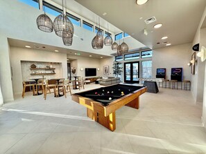 A spacious indoor area with a pool table, seating, and a bar area. - Luxury Sandbar Oasis | Pool + Private Hot Tub (Washington)
