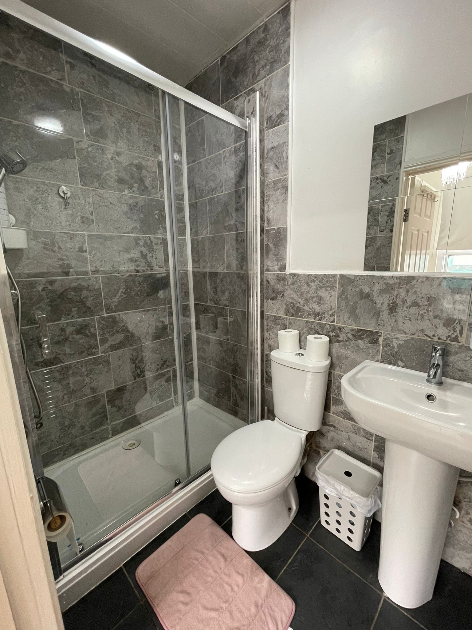 Shower, hair dryer, towels, toilet paper