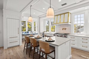 Fridge, microwave, oven, stovetop - Kingfish House: Luxury Canal Home, Boat Dock, Pool, Spa by Anna Maria Life Vacation Rentals (Anna Maria)