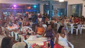 A crowded indoor venue with tables and chairs arranged for dining. - CostaeCunhaIpe104  (Iguaba Grande)
