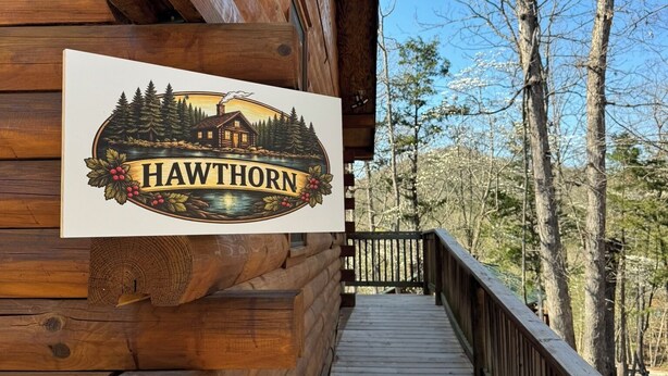 A wooden cabin with a sign reading 'HAWTHORN' and a wooden deck leading to the entrance. - The Hawthorn on Table Rock Lake, 2 Bed/2 Bath Log Cabin, Pool, Hot Tub & Dock (Shell Knob)