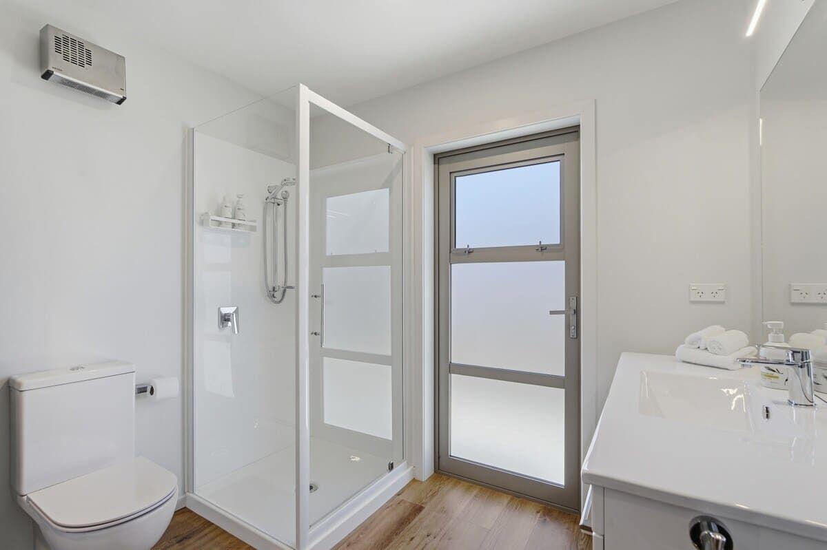 Shower, hair dryer, towels, shampoo