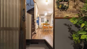 A hotel hallway with a staircase leading to a dining area.