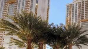 A high-rise building with multiple balconies and a clear sky. - Corner Suite with Strip View, F1, Balcony at MGM Signature, NO Resort Fee - 1621 (Las Vegas)