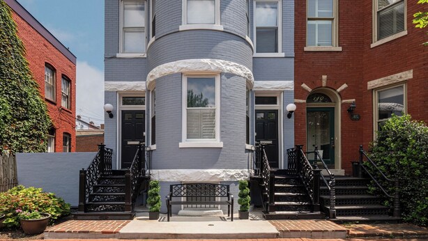 A Victorian-style building with a turret, a front porch, and a staircase leading to the entrance. - Capitol Hill, 3 Apartments, 1 House, Free Parking (Washington)