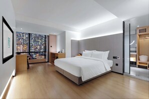 A modern hotel room with a large bed, a nightstand, a desk, and a wardrobe. - come and stay at S Hotel（Chongqing Jiefangbei Store ） (Chongqing)