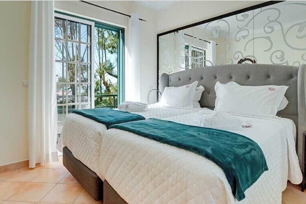 Unwind in a serene room with plush pillows and soft throws.