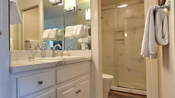 Shower, hair dryer, towels, soap