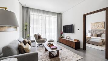 Apartamento Deluxe, balcón | Zona de estar