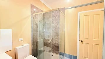 Shower, hair dryer, towels, shampoo