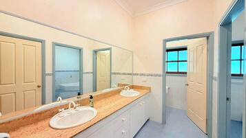 Shower, hair dryer, towels, shampoo