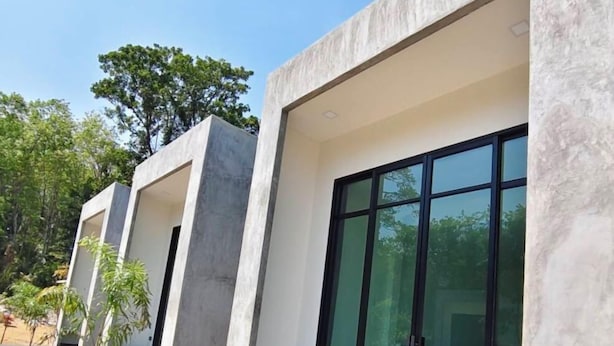 A modern building with large glass doors and a flat roof. - Pearlix Koh Mook (Ko Mook)