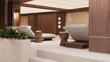 Un espace spa moderne comprenant un banc en pierre, une table de massage et un petit tabouret en bois.