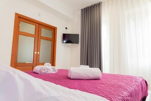 Triple Room, Balcony, City View | In-room safe, free WiFi