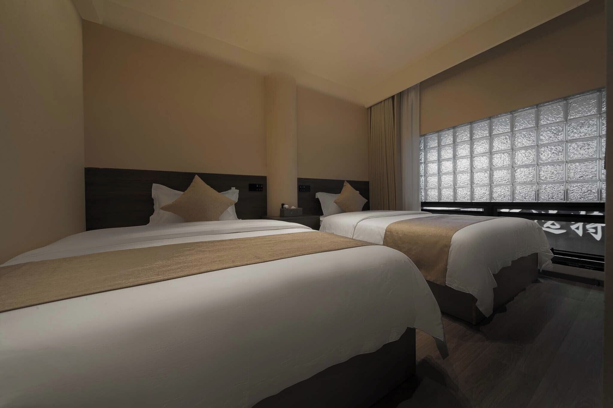 Family Triple Room, City View | Blackout drapes, free WiFi, bed sheets