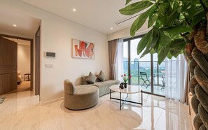 Luxury Apartment, 2 Bedrooms, Kitchen, City View | Living area | 56-inch Smart TV with digital channels - Honey The Opera Luxury Residence (Thu Thiem)