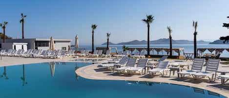 2 outdoor pools, open 10:00 AM to 6:00 PM, free cabanas, pool umbrellas