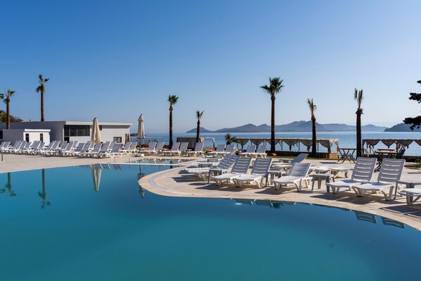 2 outdoor pools, open 10:00 AM to 6:00 PM, free cabanas, pool umbrellas