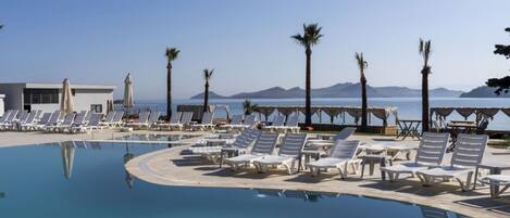 2 outdoor pools, open 10:00 AM to 6:00 PM, free cabanas, pool umbrellas