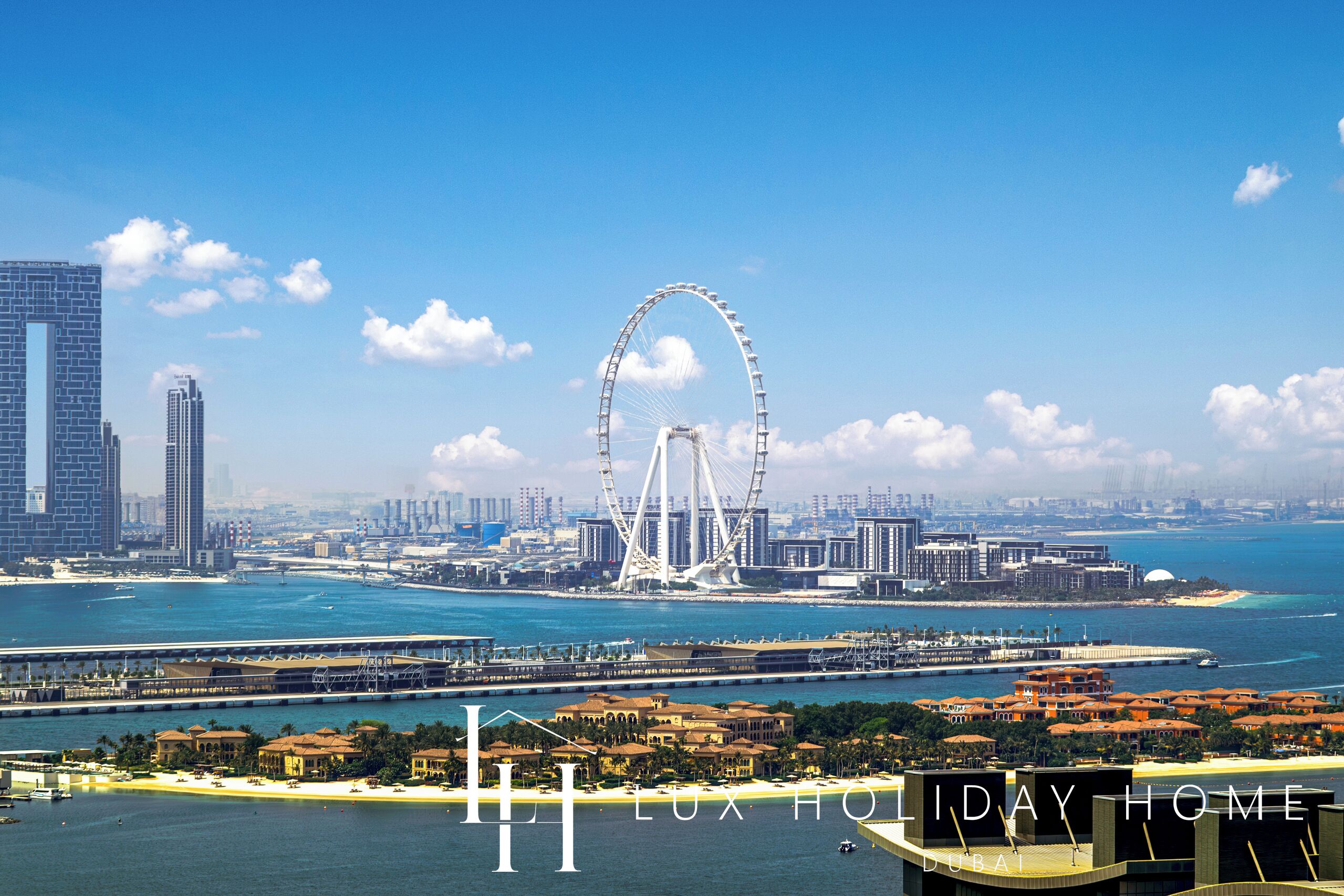A coastal cityscape with a prominent Ferris wheel, a marina, and a beachfront area.