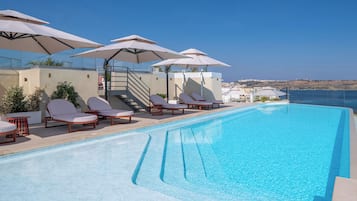 Indoor pool, outdoor pool, pool umbrellas, sun loungers